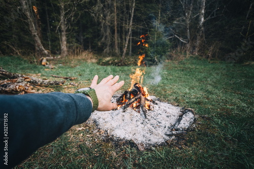 survival man warming her ha...