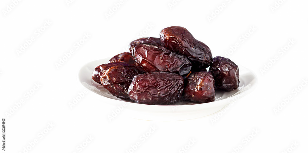 Isolated Organic Dates on white background. Close up. Horizontal. Isolated Organic Dates on white background. Close up. Horizontal.