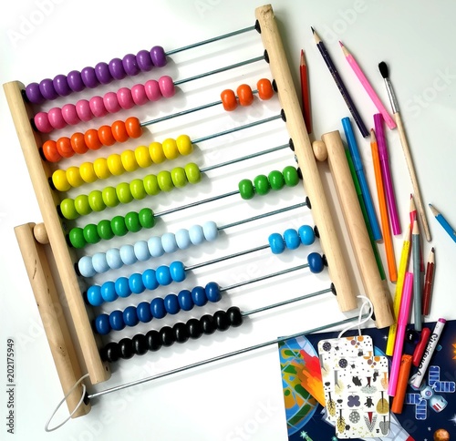 Children s multicolored abacus  pencils  markers