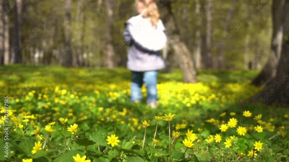little girl runs in the spring blossoming forest little girl runs in the spring blossoming forest