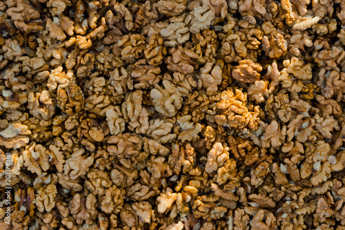 some walnut seeds forming a background pattern