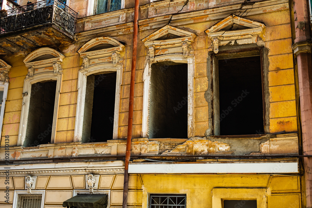 TBILISI, GEORGIA - MARCH 9, 2016: Facade of traditional house in old town Tbilisi, Georgia TBILISI, GEORGIA - MARCH 9, 2016: Facade of traditional house in old town Tbilisi, Georgia