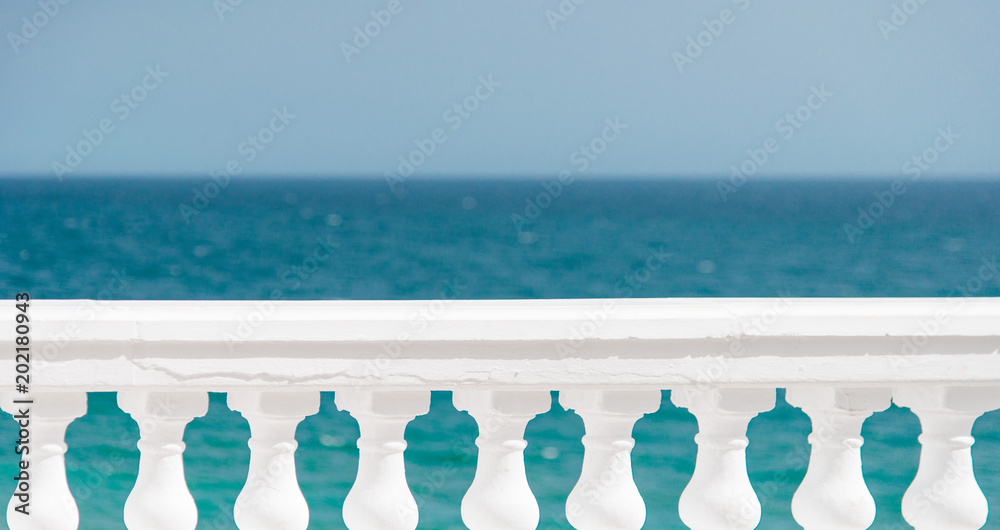greek columns in front of blue, turquoise sea, ocean