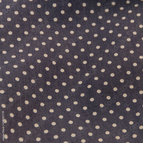 natural fabric texture with pattern, white circles on dark blue