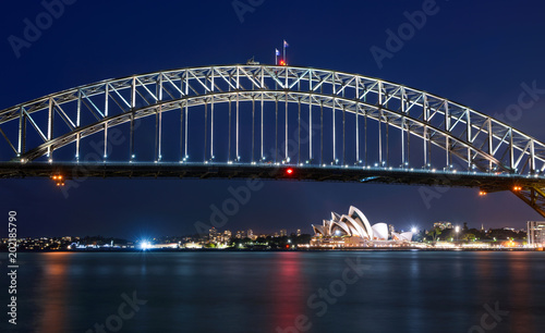 Long exposure of Sydney Harbour Bridge at night against a deep blue sky © David Carillet