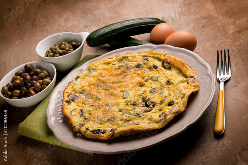 omelette with zucchinis black olives and capers