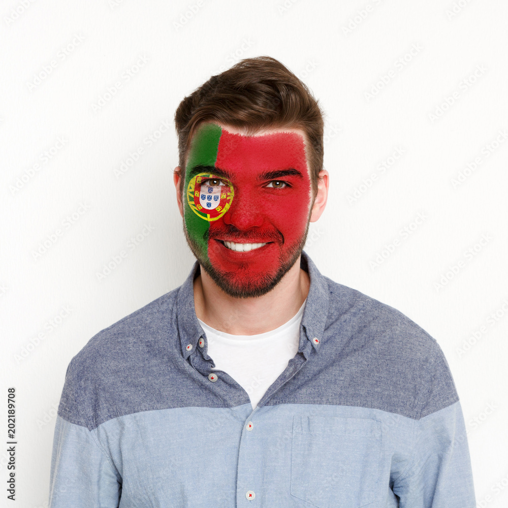 Young man with Portugal flag painted on his face Young man with Portugal flag painted on his face