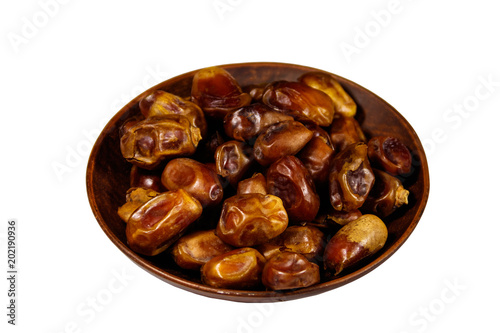 Dried date fruits in ceramic plate isolated on white background