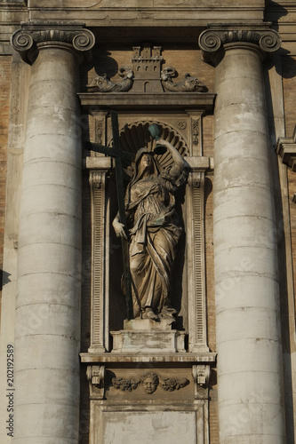 Statue near the entrance to Cathedral in Cesena city, Italy photo