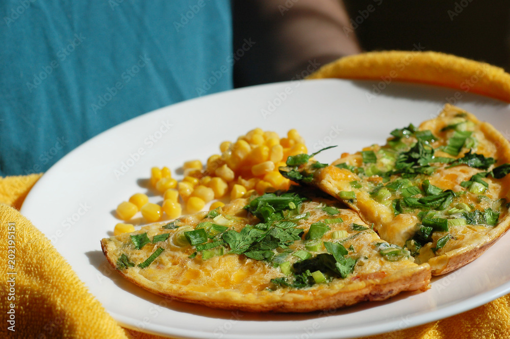 fried eggs with tomatoes, onions and parsley and corn fried eggs with tomatoes, onions and parsley and corn
