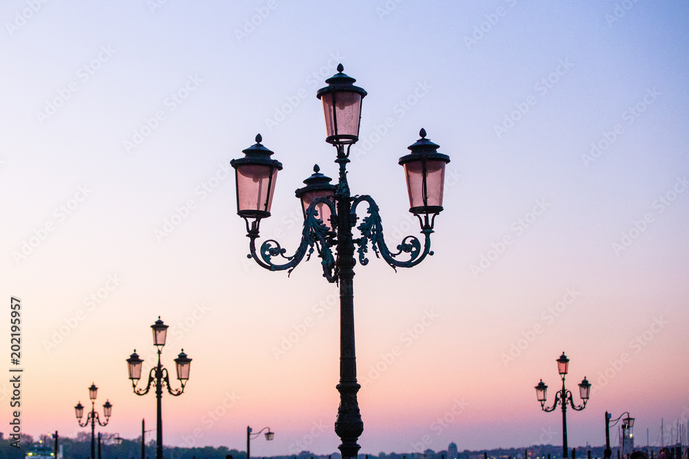 Beautiful street lamps in Venice, Italy at sunrise