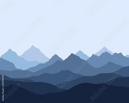 panoramic view of the mountain landscape with fog in the valley below with the alpenglow blue sky