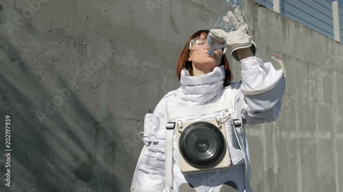 Portraitgirl girl astronaut drinks water sunny day photo