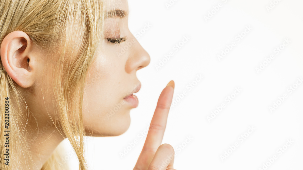 Woman showing silence gesture Woman showing silence gesture