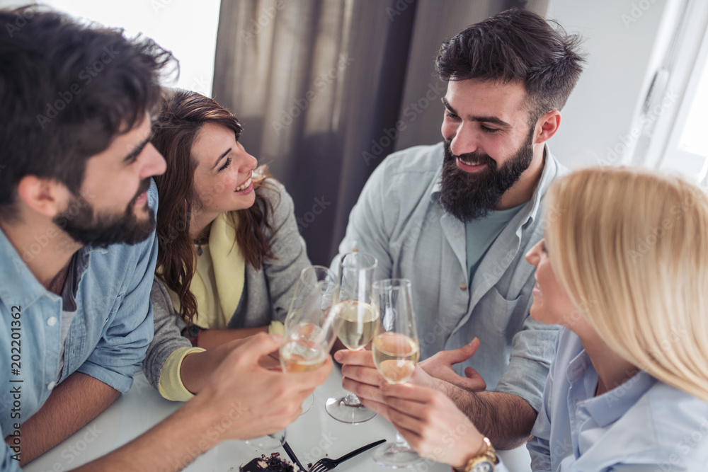 Group of friends having great time together at home