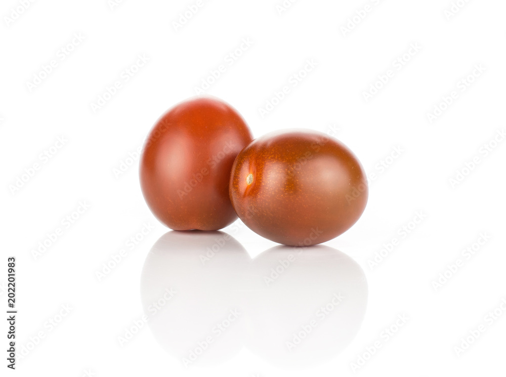 Black red grape cherry tomatoes isolated on white background two ripe. Black red grape cherry tomatoes isolated on white background two ripe.