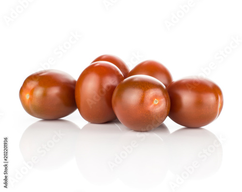Six black red grape cherry tomatoes isolated on white background.