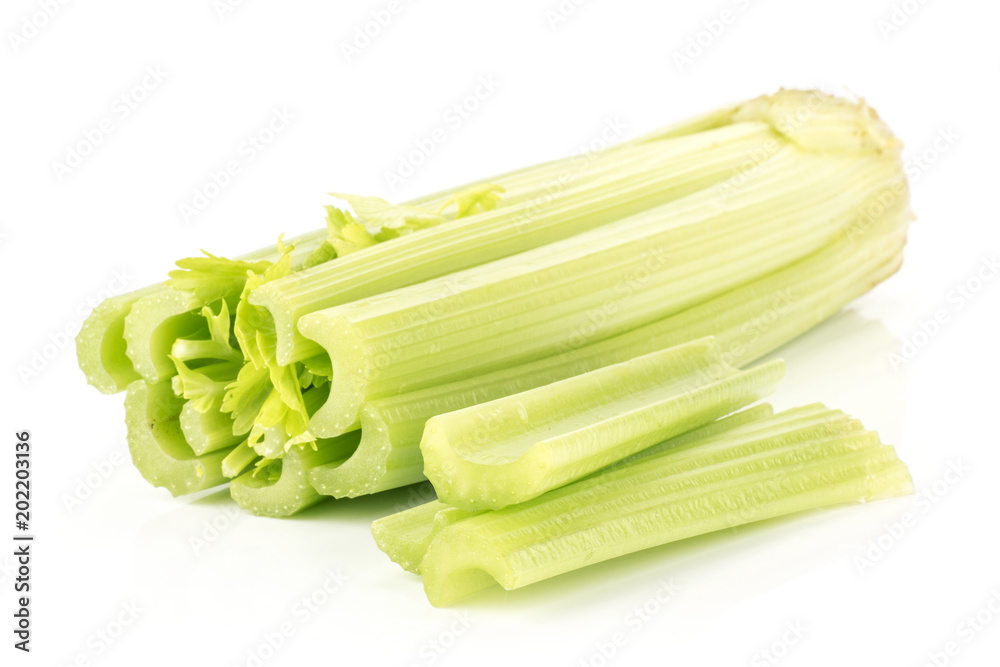 Fresh green celery with three sliced sticks isolated on white background. Fresh green celery with three sliced sticks isolated on white background.