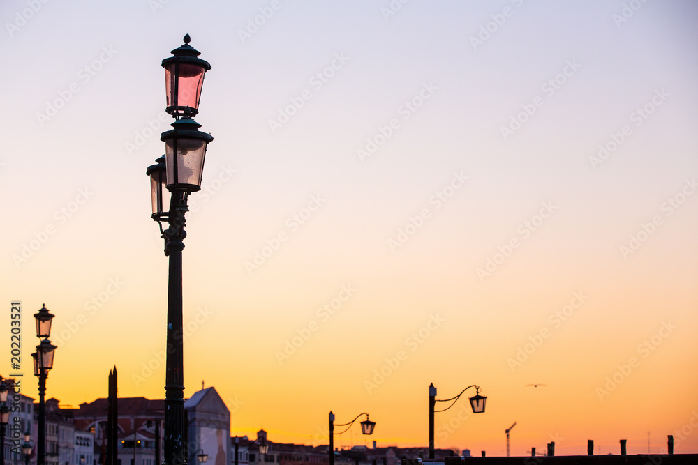 Street lamp silhouette in Venice, Italy at sunrise