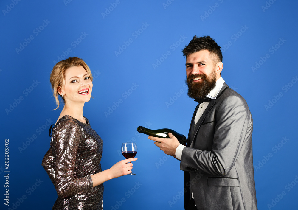 Winetasting and celebrating concept. Lady and gentleman holding glass