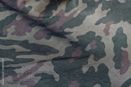 Military uniform pattern with blur effect.
