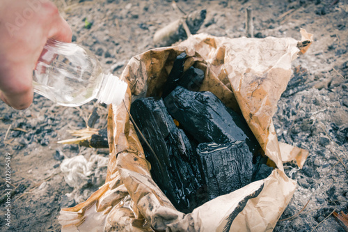 Irrigation of charcoal for grilling. photo