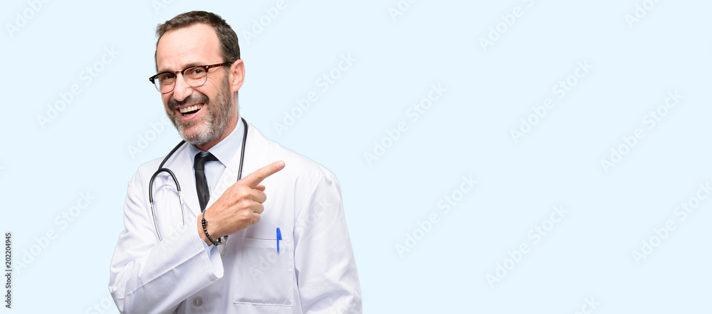 Doctor senior man, medical professional pointing away side with finger isolated over blue background