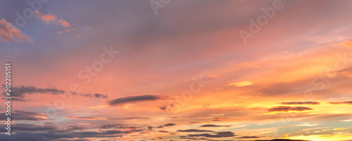 Fototapeta Naklejka Na Ścianę i Meble -  Gray, blue and orange cloud at sunset