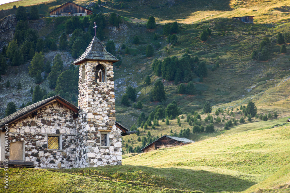 idyllic landscape, a church in the Dolomites Alp