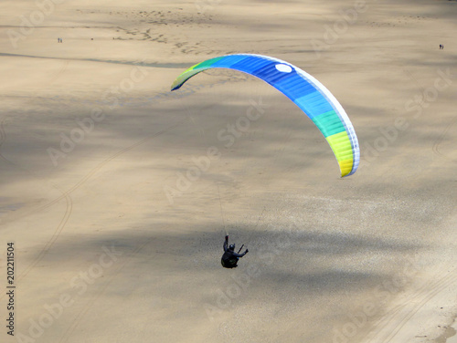 Paraglider above Perranporth Beach