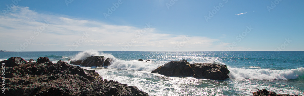 Waves breaking on rocky coast at Cerritos Beach between Todos Santos and Cabo San Lucas in Baja California Mexico BCS