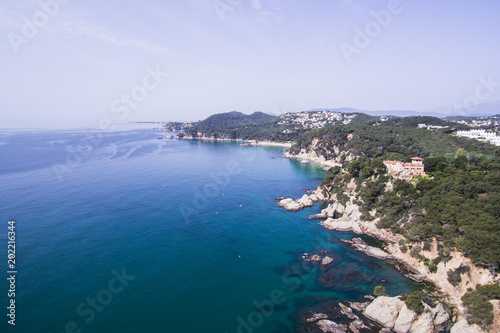 Aerial view of the rocks in the sea on a sunny day in the Costa Brava in Spain © Victor