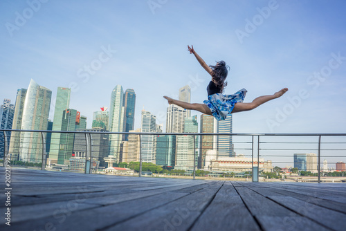 Ballet dancer woman dancing ballet in the city