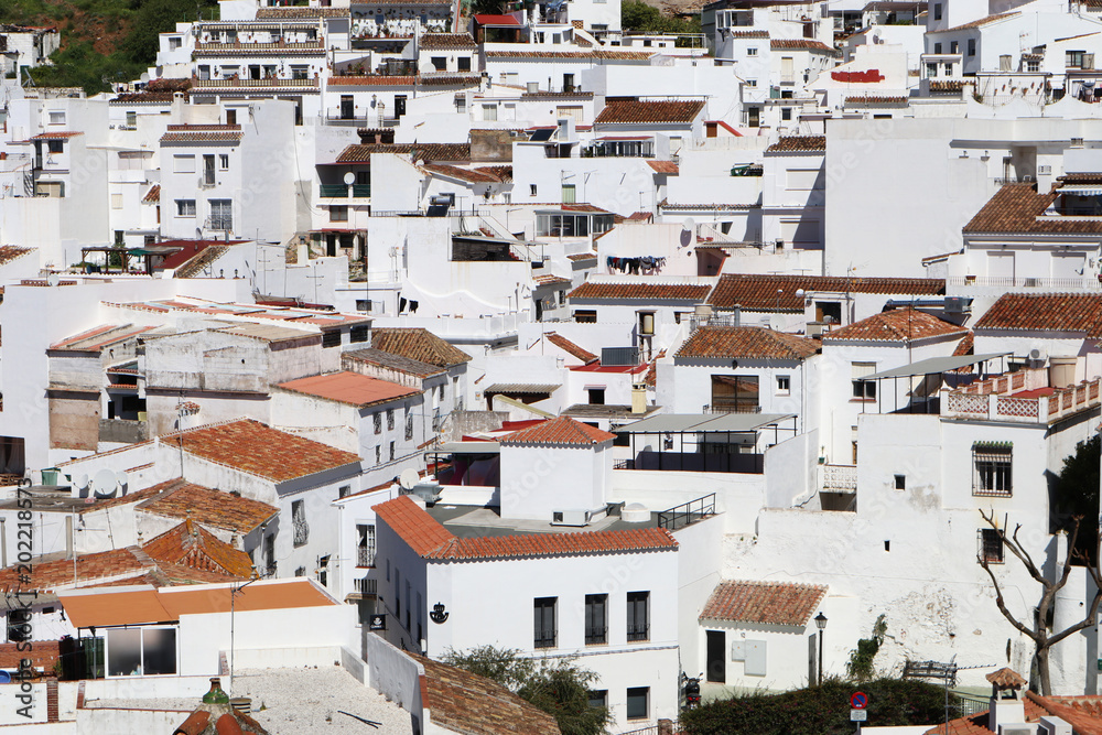 A close up cross section of white houses in the village of Mijas Pueblo in Spain
