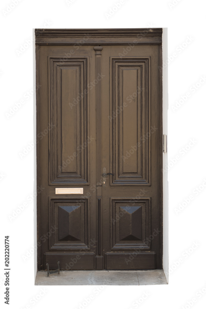 Old carved brown wooden door isolated on white background, surface. House or building exterior detail and decoration. Old and retro wooden door