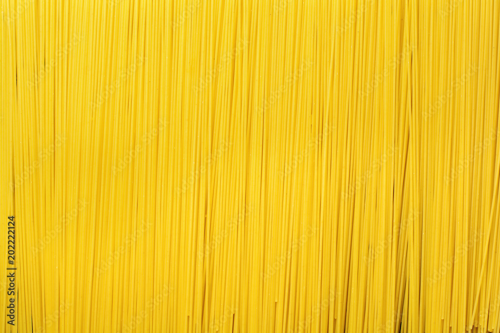 Abstract background texture of pasta closeup. Raw Spaghetti. Selective focuse. Top view. Abstract background texture of pasta closeup. Raw Spaghetti. Selective focuse. Top view.