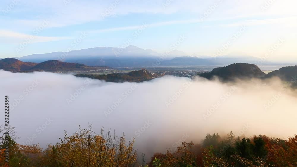 Aerial view of the foggy alpine lake Bled. Location Julian Alps, Slovenia, Europe. Aerial view of the foggy alpine lake Bled. Location Julian Alps, Slovenia, Europe.