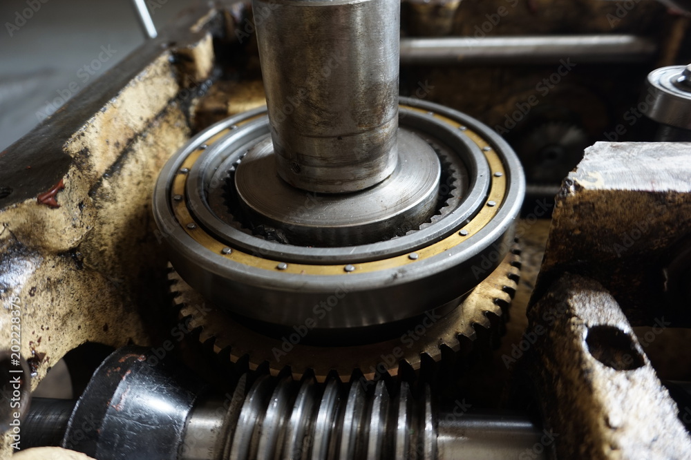 Disassembled machine with reducer, screws, bearings, worm shaft. Disassembled machine with reducer, screws, bearings, worm shaft.
