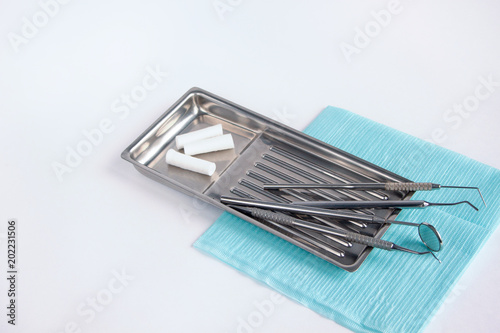 Group of dental tools and accessories for dental treatment. Isolated on white background.