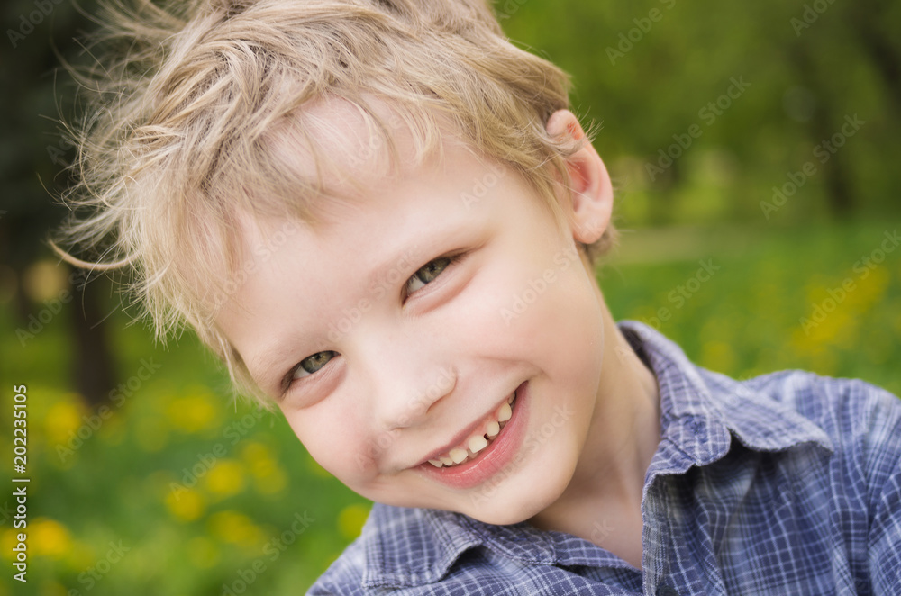 Closeup portrait of little cute funny boy with white hair looking at camera  smiling while playing outdoors on warm spring or summer day. Horizontal  color photography. Stock Photo | Adobe Stock
