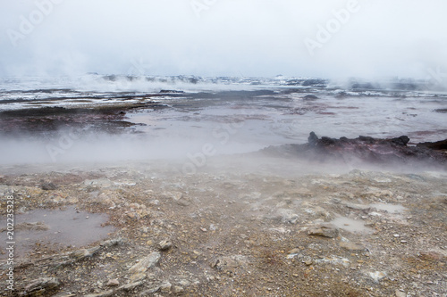 Steam rising from the ground at the hot spring