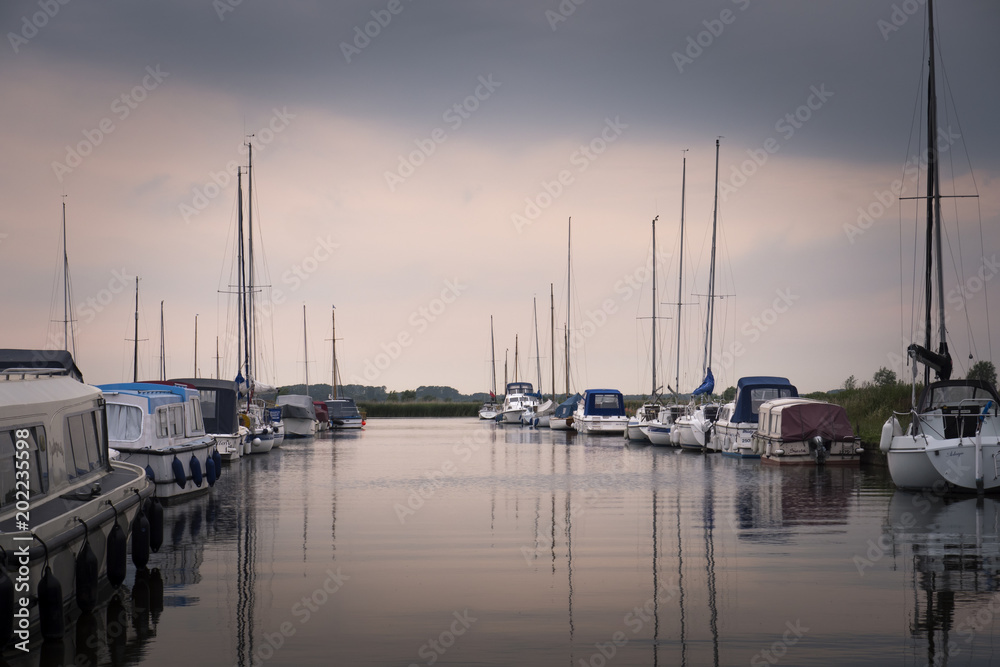 Pleasure boats moored at Thurne Great Yarmouth Norfolk England