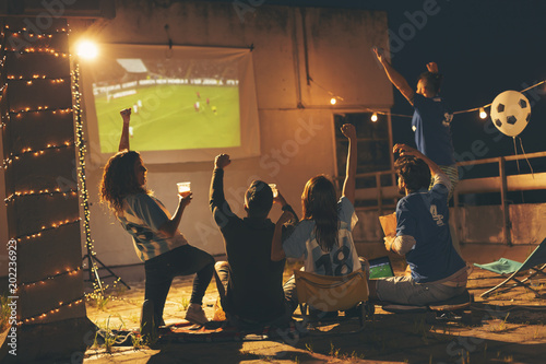 Friends watching a football match