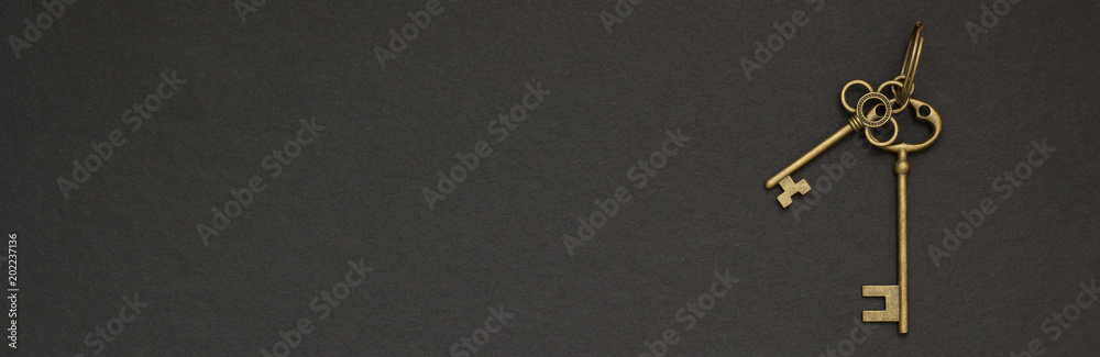 Old golden key on a black background space for text Old golden key on a black background space for text