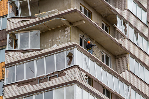 Obninsk  Russia - April 22  2018  Damage to loggias on a 20-storey house as a result of a strong hurricane wind. Workers dismantle damaged structures