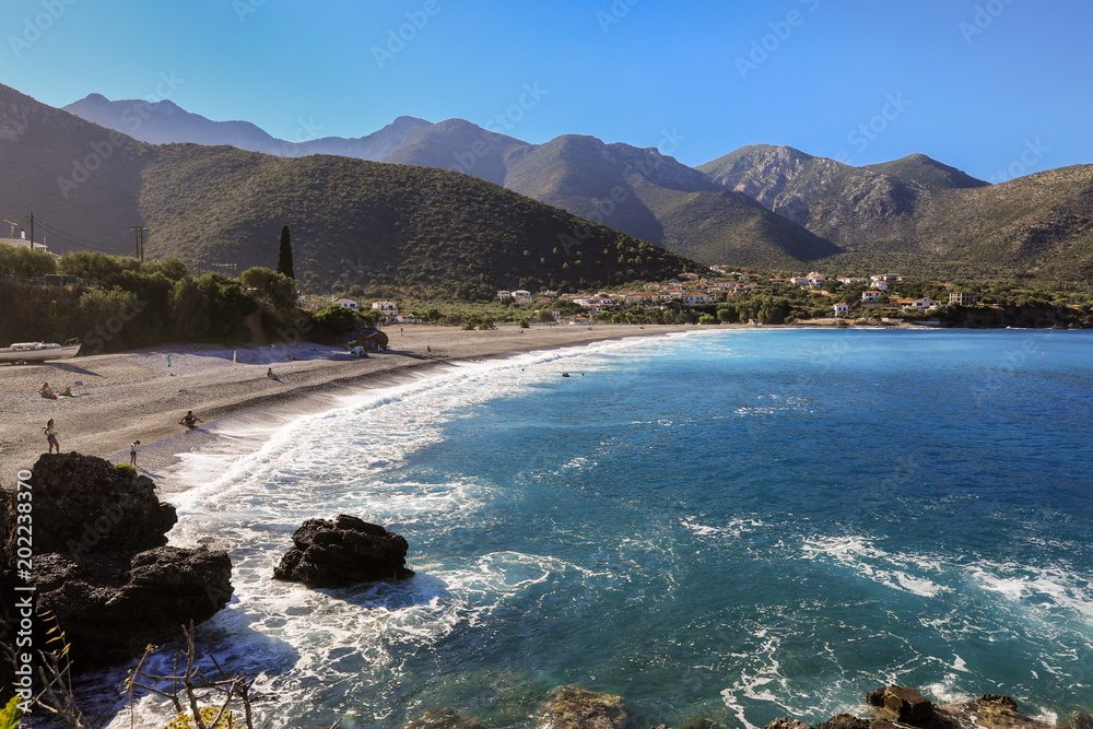 Fototapeta premium Fantastic seascape beautiful beach of the greek village Kiparissi Lakonia, Peloponnese during summer holidays.