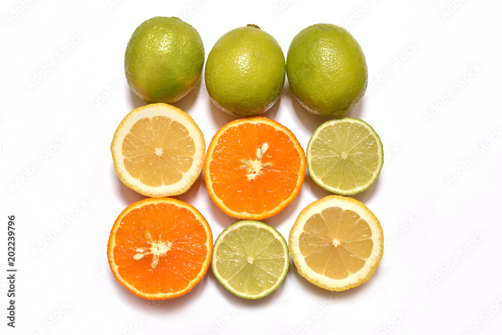 Fresh sliced lemon, lime and orange on a white surface