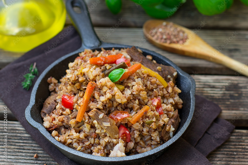 Buckwheat porridge kasha with tomato, carrots, mushrooms Buckwheat porridge kasha with tomato, carrots, mushrooms