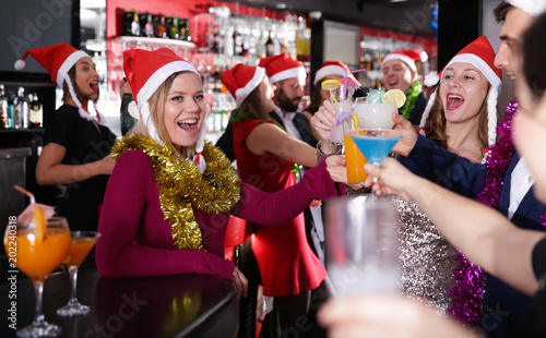 Man with females on corporate new year party in bar