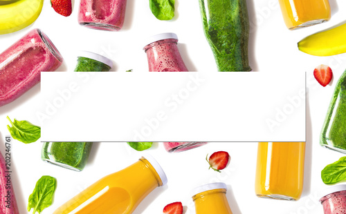 Colorful smoothies in bottles with blank isolated sheet for your text or design. Natural Organic Food Style.